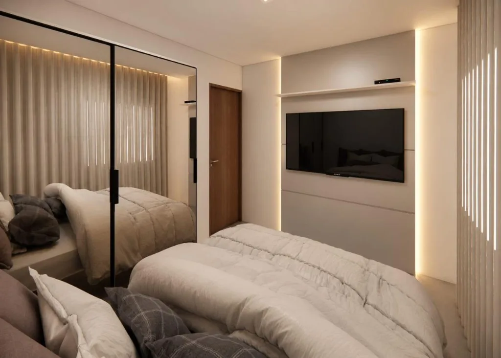 Quarto com TV e guarda-roupa espelhado do apartamento decorado do Wave Jacumã Residence