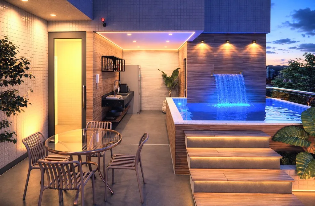 Espaço gourmet do rooftop do Wave Jacumã, com cozinha externa e piscina